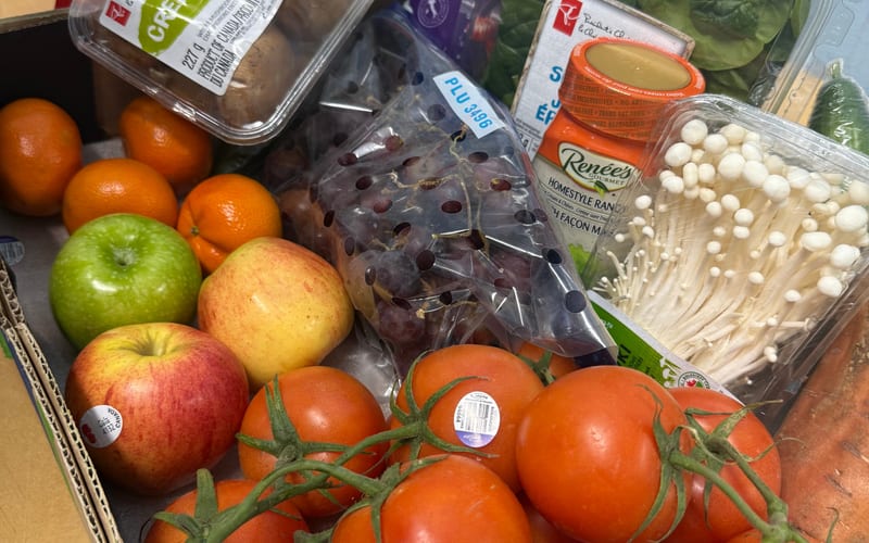 Volunteers distributing food at Nourishing Neighborhoods